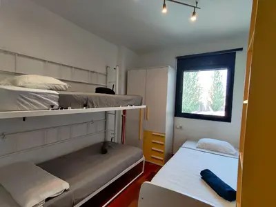 a bedroom with two bunk beds and a window at Barcelona-Forum Apartments in Barcelona