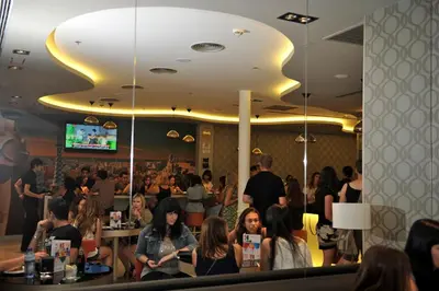 a crowd of people sitting in a restaurant at Hotel Indigo Barcelona - Plaza Catalunya 4Sup by IHG in Barcelona