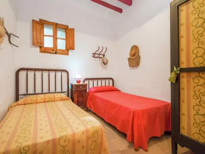 a bedroom with two beds and a window at Cottage in Pacs near St Marti Sarroca Castle in Pacs del Penedes