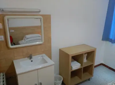 a bathroom with a sink and a mirror at Hostal River in Barcelona