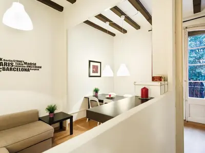 a living room with a couch and a table at Sant Antoni Market in Barcelona