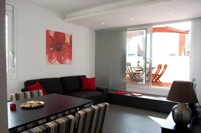 a living room with a couch and a table at Sant Pau Terraces Apartments in Barcelona