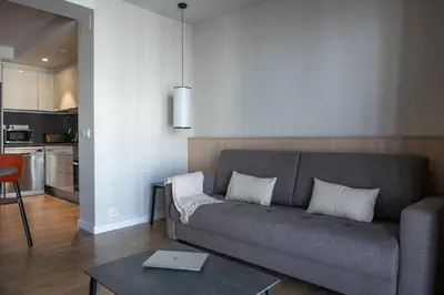 a living room with a couch and a table at MH Apartments Urban in Barcelona