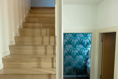 a staircase in a house with a blue wallpaper at MH Apartments Sant Pau in Barcelona