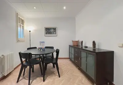 a dining room with a table and chairs at Stay U-nique Apartments Calabria in Barcelona