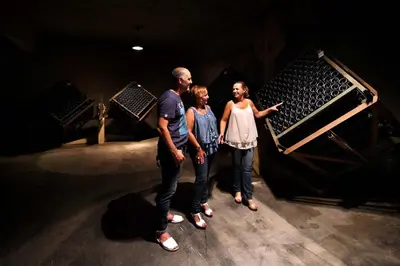 a group of three people standing on a stage at Mastinell Cava & Boutique Hotel by Olivia Hotels Collection in Vilafranca del Penedès