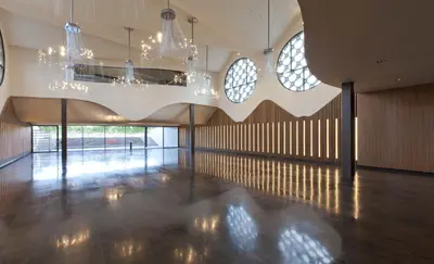 a large room with chandeliers and a wooden floor at Mastinell Cava & Boutique Hotel by Olivia Hotels Collection in Vilafranca del Penedès