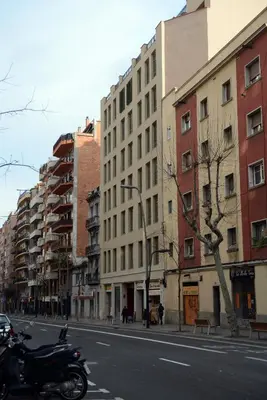 a motorcycle parked on a city street with buildings at Pierre & Vacances Barcelona Sants in Barcelona