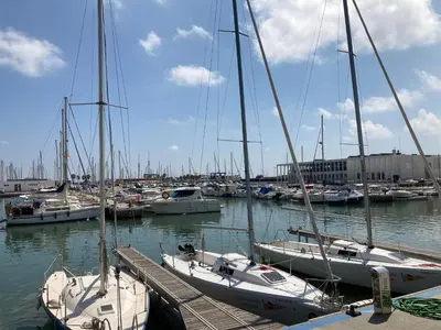 a group of boats docked in a harbor at Beach Apartment in Vilanova i la Geltrú
