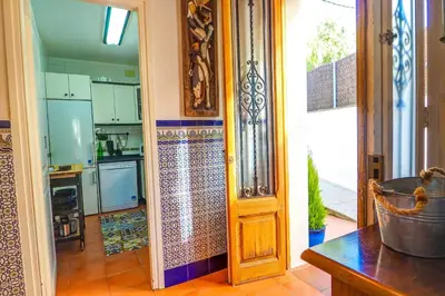 a kitchen with a door leading to a kitchenasteryasteryasteryasteryasteryasteryastery at The Beach House Paradise by Hello Homes Sitges in Sitges