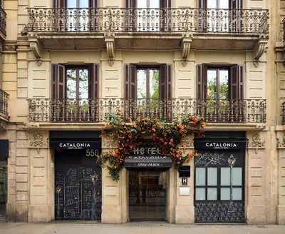 an apartment balcony with a view of buildings at Catalonia Gran Via BCN in Barcelona