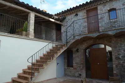 an external view of a house with a staircase at Cal Puó Turismo Rural in Collsuspina
