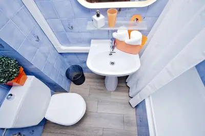 a bathroom with a white sink and a toilet at Barcelona City Seven Hostal in Barcelona