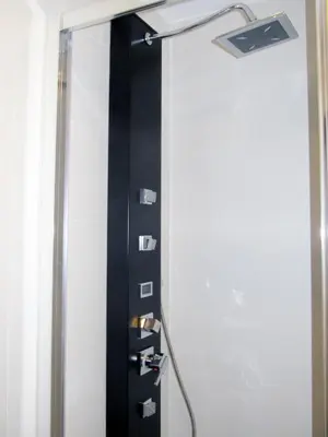 a door with a lamp on the wall at Barcelona Fifteen central Aparthotel in Barcelona