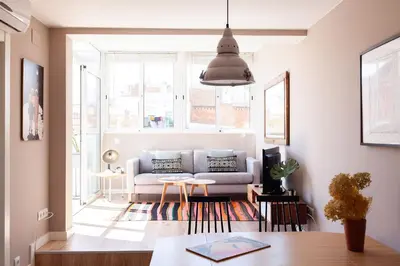 a living room with a couch and a table at Brummell Apartments Poble Sec in Barcelona