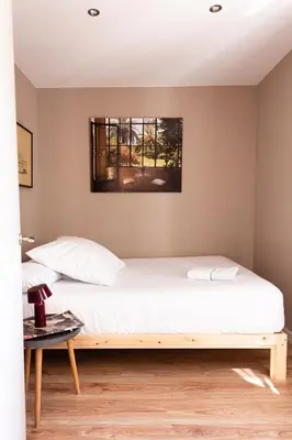 a dining room with a wooden table and chairs at Brummell Apartments Poble Sec in Barcelona