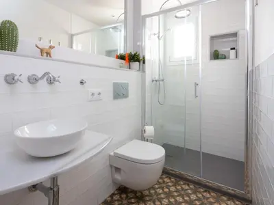 a bathroom with a toilet and a sink and a shower at Casa Cosi - Francoli 1 in Barcelona