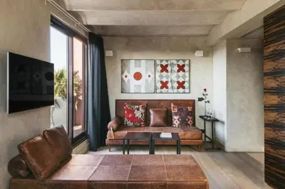 a living room with a couch and a table at Aparthotel Arai 4* Superior in Barcelona