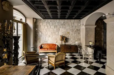 a living room with a couch and chairs at Aparthotel Arai 4* Superior in Barcelona