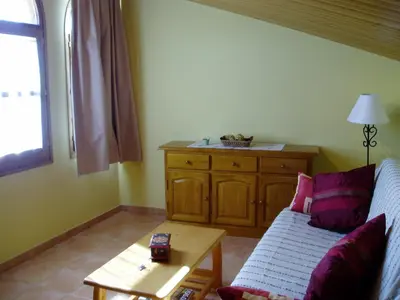 a living room with a couch and a table at Mansion in Maians with Private Pool in Castellfullit del Boix
