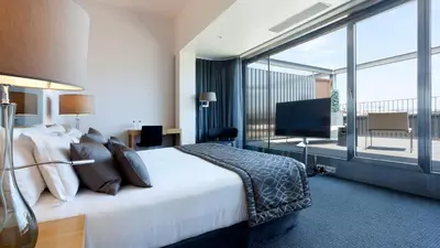 a hotel room with a bed and a large window at Hotel Royal Passeig de Gracia in Barcelona