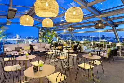 a restaurant with tables and chairs and lights at Hotel Royal Passeig de Gracia in Barcelona