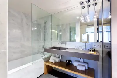 a bathroom with a sink and a shower at Hotel Royal Passeig de Gracia in Barcelona