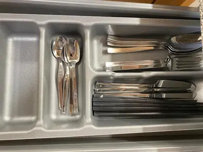 a plastic container with utensils in a drawer at Urban Manresa-City center apartment with balcony in Manresa