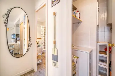 a bathroom with a mirror and a sink at Vivalidays ilaria - Calella in Calella