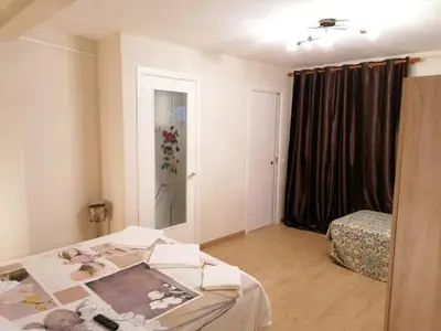 a room with a bed and a window and a bedroom at Hostel Penedes in Vilafranca del Penedès