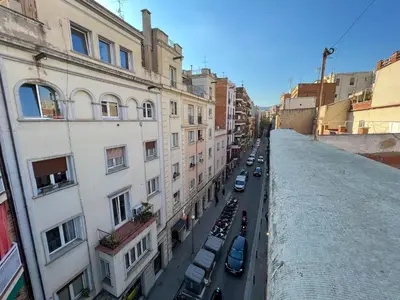 a view of a city street with buildings and cars at Stay U-nique Apartments Torrent in Barcelona