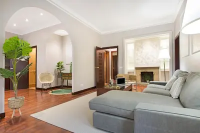 a living room with a couch and a fireplace at Stay U-nique Apartments Calvet in Barcelona