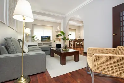 a living room with a couch and a table at Stay U-nique Apartments Calvet in Barcelona