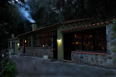 a house at night with a lit up at Can Barrina in Montseny