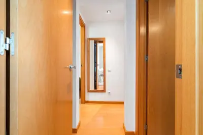 an empty hallway with a door and a mirror at Rooftop Terrace BBQ in Gràcia AC in Barcelona