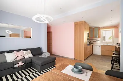 a living room with a couch and a table at Three bedrooms apartment in Barcelona