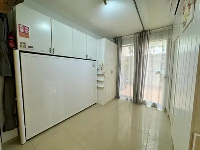 a kitchen with a large refrigerator and a window at BADAROSA House10min to BARCELONA City&NearTo BEACH in Badalona
