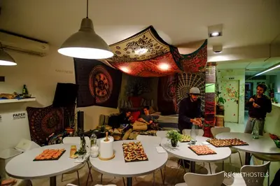 a group of tables with food on top at Rocket Hostels Gracia in Barcelona