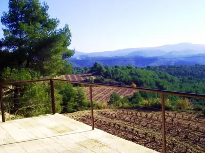 a balcony with a view of a field at CAN MAGINET in Avinyonet