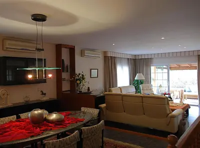 a living room with a couch and a table at Villa Magnolia in Mataró