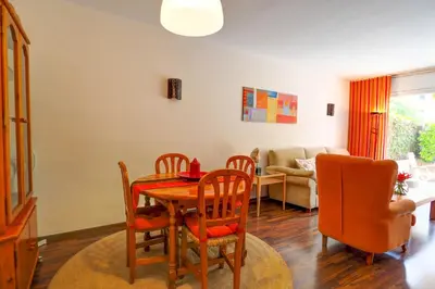 a dining room with a table and chairs at Megan Apartment by Hello Homes Sitges in Sitges