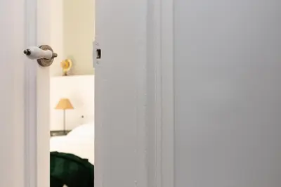 a door open to a bedroom with a bed at Casa Cosi - Eixample 4 in Barcelona