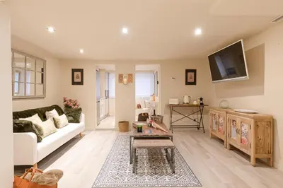 a living room with a couch and a tv at Chic Apartments Barcelona in Barcelona