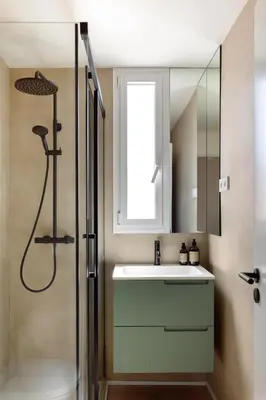 a bathroom with a sink and a shower with a mirror at C211 Barcelona - Simaba Group in Barcelona