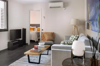 a living room with a couch and a tv at C211 Barcelona - Simaba Group in Barcelona