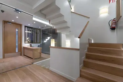 a staircase in a house with white walls and wooden floors at Casa Bella Gracia by Aspasios in Barcelona