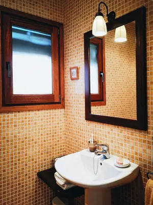 a bathroom with a sink and a mirror at El Porxo de Can Baixeres PB-00318 in Montseny