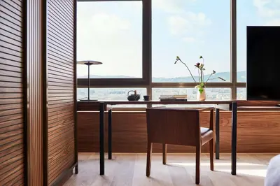 a dining room with a table and a window at Nobu Hotel Barcelona in Barcelona