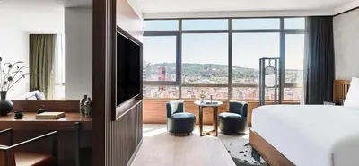 a hotel room with a bed and a large window at Nobu Hotel Barcelona in Barcelona