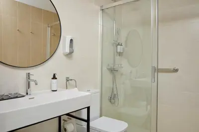 a bathroom with a sink and a shower at Hostal Centric in Barcelona
